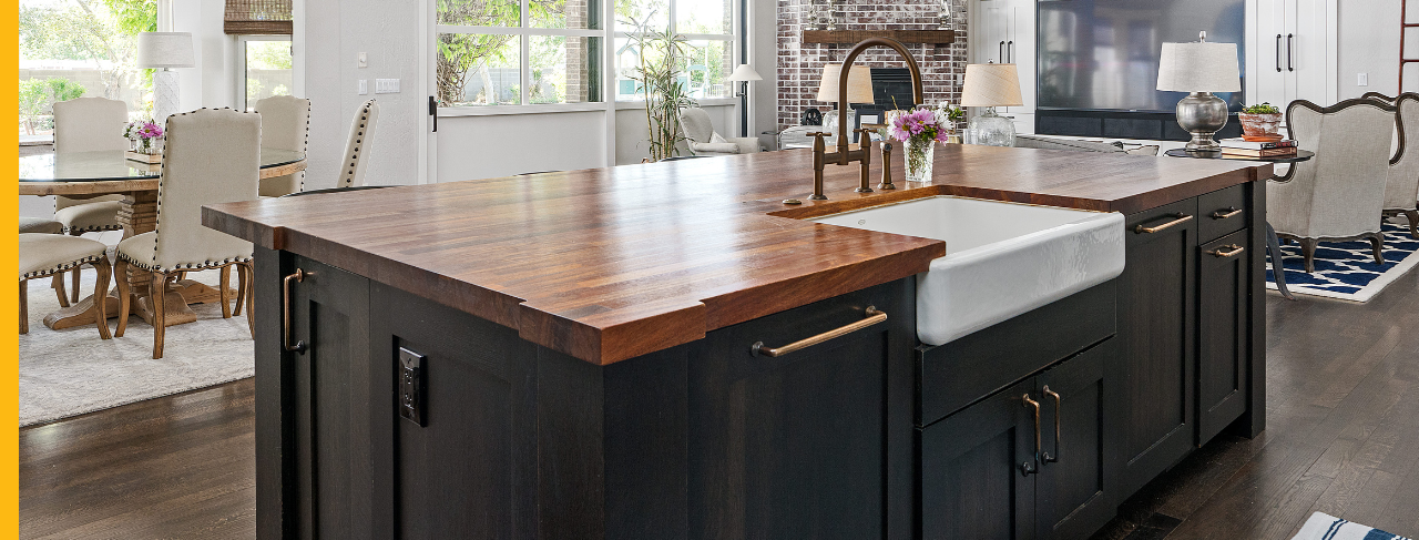 black painted kitchen cabinets with wood accent